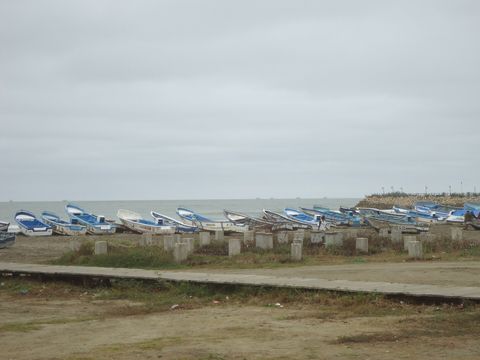Fishing boats on the beach in Playas, Ecuador
